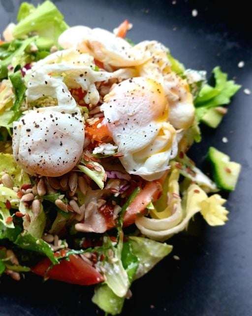 Salad with poached quail eggs